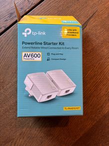TP-Link AV600 Powerline Starter Kit, model TL-PA4010 KIT. Includes 2 powerline adapters and original box. Plug and play, ideal for extending wired internet connection to another room.