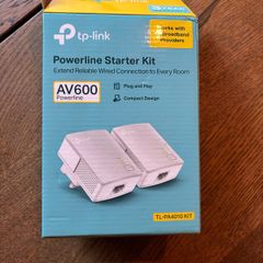 TP-Link AV600 Powerline Starter Kit, model TL-PA4010 KIT. Includes 2 powerline adapters and original box. Plug and play, ideal for extending wired internet connection to another room.