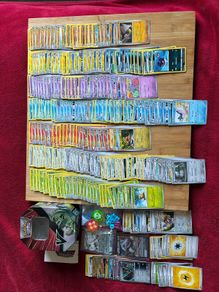Pokemon large Sized Storage Tin and 250 cards and 2 v/ex cards