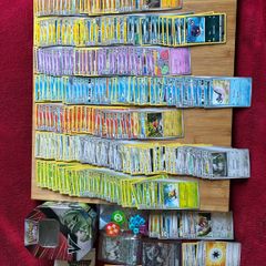 Pokemon large Sized Storage Tin and 250 cards and 2 v/ex cards
