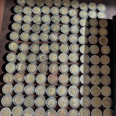 2 Euro commemorative coins in used/good condition + album
