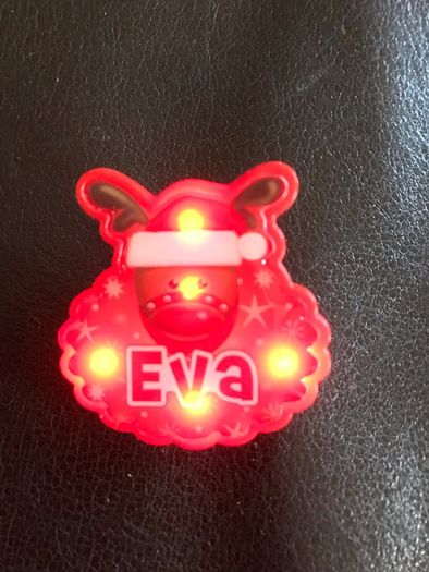 Christmas flashing badge named Eva