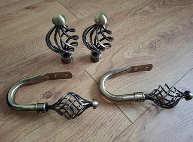 Decorative pair of antique brass cage swirl curtain hold backs with matching finials