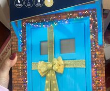 Stunning giant lit door bow