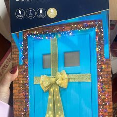 Stunning giant lit door bow