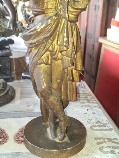 Antique Sculpture a gilt-bronze cast-metal Spanish Conquistador. On his torso is a Cross Pattee, a historical motif commonly associated with Christian military orders and medieval heraldry