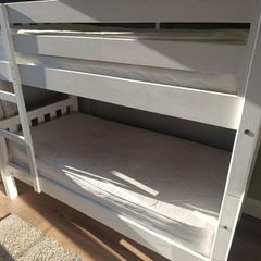 Bunk bed with mattresses, duvets and bedding sets