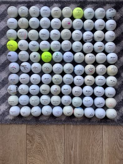 100 golf balls suitable for practice or suit a beginner