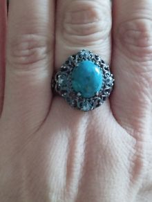 A 925 sterling silver ring with turquoise and blue topaz.