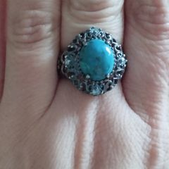 A 925 sterling silver ring with turquoise and blue topaz.