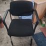 white meeting table with 4 black meeting chairs Image 2