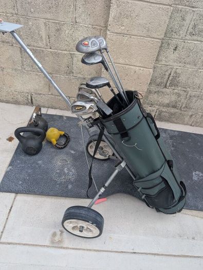 Cheap set of golf clubs and trolley