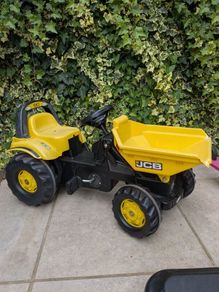 JCB with front tipper with 1trailer and round bales, and toddler John Deere tractor