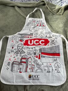 Graphic Print UCC Apron Featuring Illustrated Scenes from University College Cork