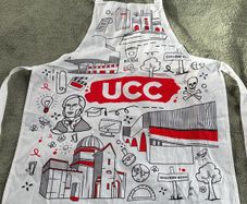 Graphic Print UCC Apron Featuring Illustrated Scenes from University College Cork