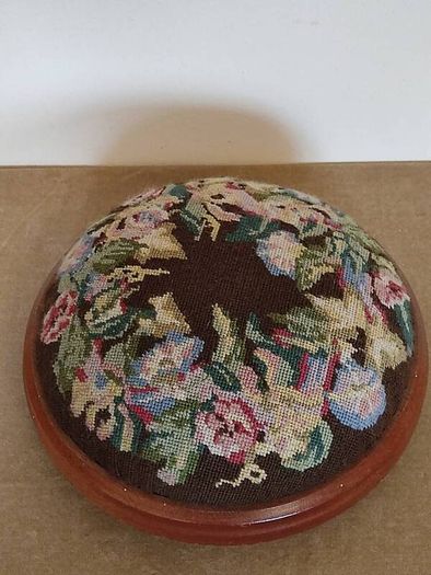 Vintage hand embroidered floral design on wooden base stool,