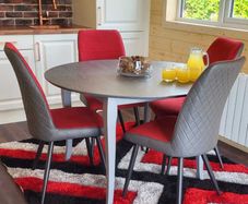 Warrington round table with 4 red harper chairs -SPECIAL OFFER