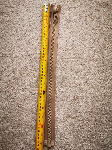 Zip, beige, separates /splits to be sewn into the jacket