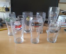 JOB LOT of 7 stamped pint glasses