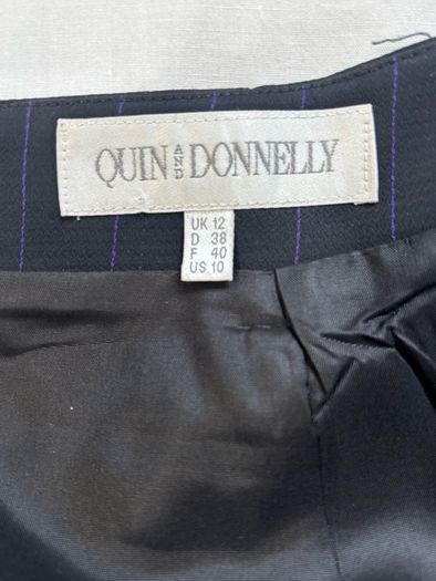 Quin and Donnelly Black with purple pin stripe and panel skirt