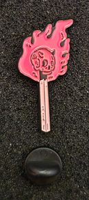 Match stick  , pin back badge.