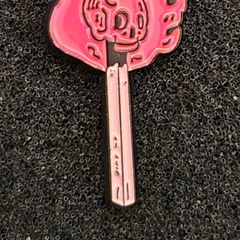 Match stick  , pin back badge.