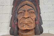 large wooden carved indian chief