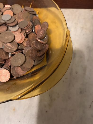 Beautiful vase full of old coins