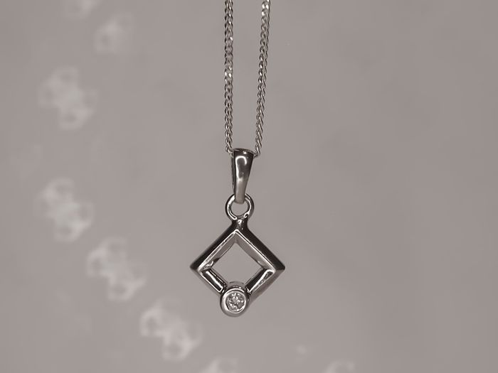 Sterling silver square pendant with a cz stone