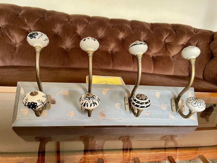 New Unused Stylish Entryway Mounted Ceramic and Brass Coat Hanger