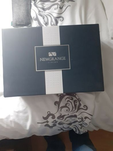 Newgrange candle holders new in box .20 euro .Would make a lovely christmas present .Glass with red and candles