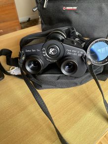 Zeica optical company battery operated zoom binoculars with extra lens that screws to front of
