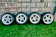 R18 5x112 Porsche Twist replica alloy wheels staggered with tyres