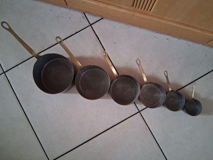 Graduated set French tinned Brass Pots and pans