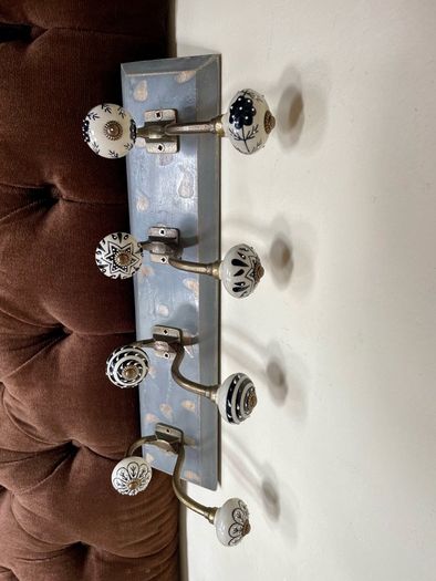 New Unused Stylish Entryway Mounted Ceramic and Brass Coat Hanger