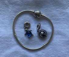Pandora silver bracelet and 2 charms