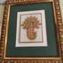Framed in gelted frameThe painting of traditional Jewellery designs in Marble is done with gold leaf and colored glass. This art has its origin in the royal city of Jaipur  once a design is drawn on marble tile. the frame is 23 x20 cm. the center is 10 x  Image 4
