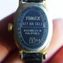Vintage Timex womens quartz watch - gold tone oval case, white dial and black strap Image 6