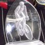 a cut glass with a cycle on it Image 2