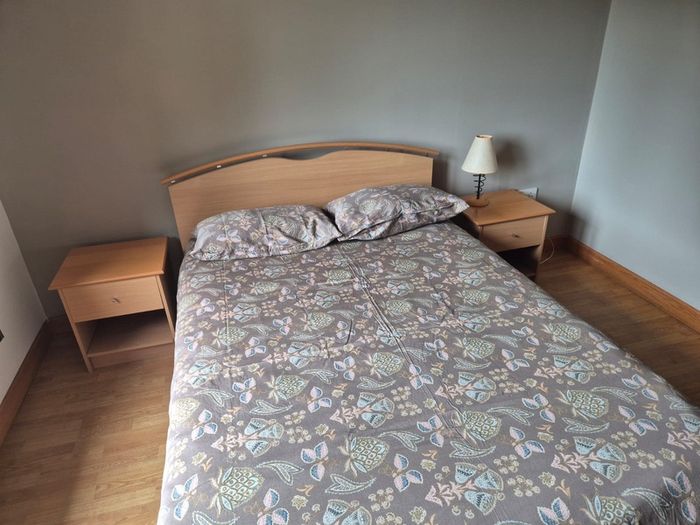 double bed with two side tables