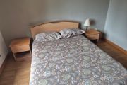 double bed with two side tables