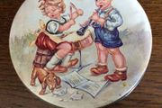 Vintage small circular sweet tin boy and girl design aged