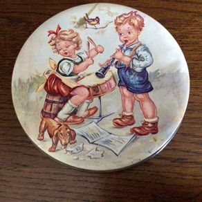 Vintage small circular sweet tin boy and girl design aged