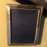 A sterling silver glazed photo frame in total dimensions 8 1/4 x  x 6 1/4 inches take photo 7 x 5 inches. Set with velvet mounts in very good condition. Image 6