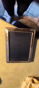 A sterling silver glazed photo frame in total dimensions 8 1/4 x  x 6 1/4 inches take photo 7 x 5 inches. Set with velvet mounts in very good condition.
