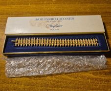Rare Find. 1960s Avon Starflower gold plated bracelet in original box.