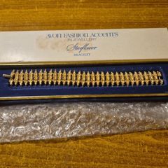 Rare Find. 1960s Avon Starflower gold plated bracelet in original box.