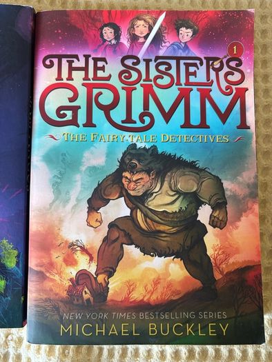 2 Children's Books . Suit 8/ 10  Plus . The Sisters Grimm & School for Skylarks.