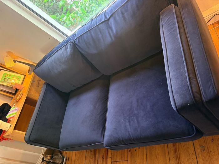 Two seater couch in navy velvet for sale