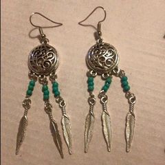 Brand new dreamcatcher earrings with feathers and turquoise beads